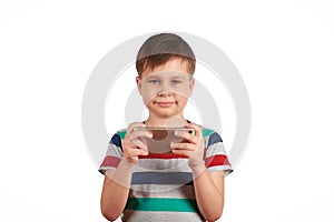 Little kid playing games on smartphone isolated over white background