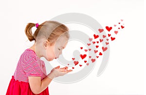 Little kid is sending heart shaped kisses