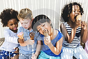 Little kids eating yummy ice cream