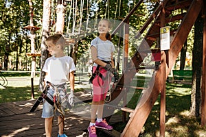 Little kids in equipment, rope park, playground