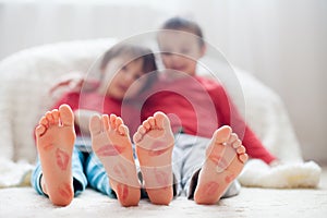 Little kids feet, covered with prints from kisses
