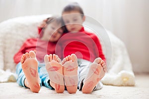 Little kids feet, covered with prints from kisses