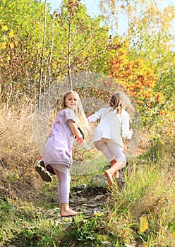 Little kids - girls walking barefoot