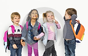 Little Kids Holding Hands Carrying Backpacks