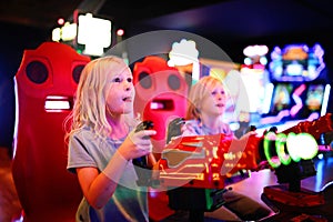 Little Kids Playing Shooting Game Challenge at Video Arcade