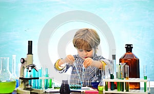 Little kids scientist earning chemistry in school lab. Knowledge day. School chemistry lessons. First grade. Chemistry