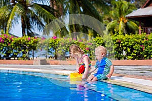 Little kids in swimming pool