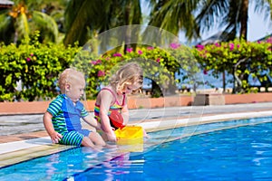 Little kids in swimming pool