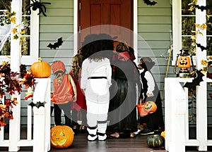 Little kids trick or treating photo