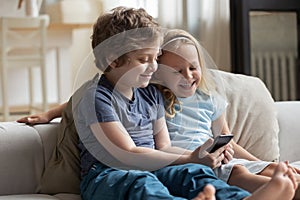 Little kids using smartphone spend free time on-line at home