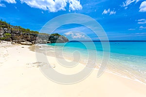 Little Knip beach - paradise white sand Beach with blue sky and crystal clear blue water in Curacao, Netherlands Antilles, a