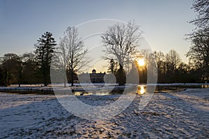 little lake Favorite Foerch Palace with snow at sunset, in winter time