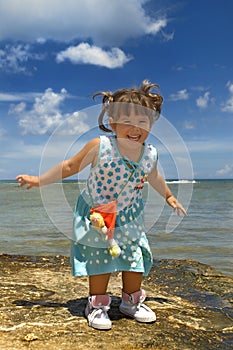 Little latin girl at the beach