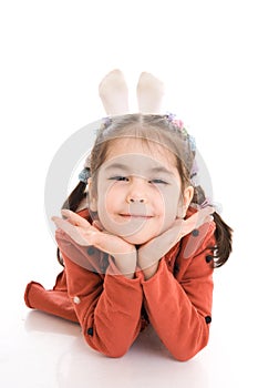 The little laying girl isolated on a white