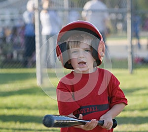 Little League player Holding Bat