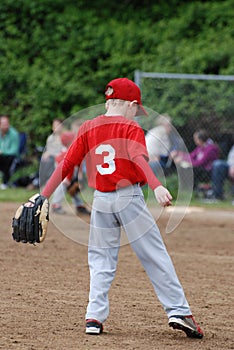 Little League player waiting for action photo