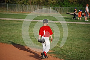 Little league player walking