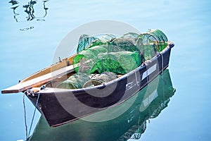 Little lonely fish boat with nets