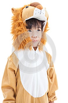 Little lovely asian boy costumed like a lion and looking ahead