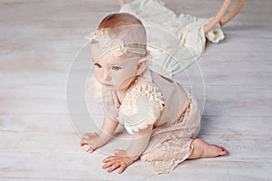 Little lovely girl  creeps on a floor