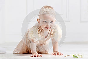 Little lovely girl  creeps on a floor