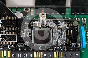 Little Man siting on a Motherboard