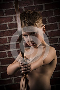 Little marksman-child with bow and arrow