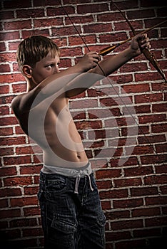 Little marksman-child with bow and arrow