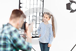 Little model poses when being photographed