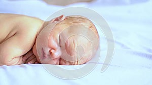 Little newborn child. Home baby portrait. Sleepy cute person