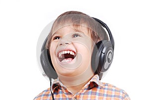 Little nice boy listening to music