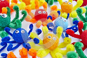 Little octopus colored toys isolated on white. Animal toys