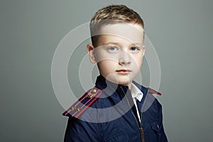 Little officer. handsom boy weared in uniform. Police child