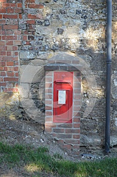 Little old Red Postbox in a Farm Wall