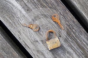 Little old rusty padlock with keys