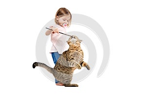 Little owner plays with her cat