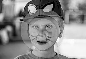 Little painted boy with cap