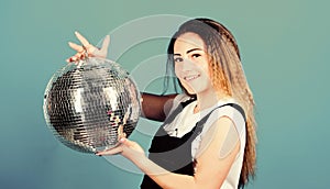 Little party never killed nobody. Dance until drop. Cheerful woman hold disco ball. Night club. Retro music. Girl