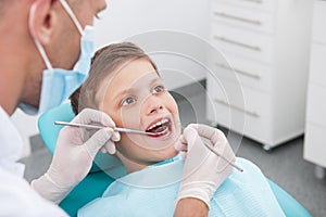 Little patient at dentist office.