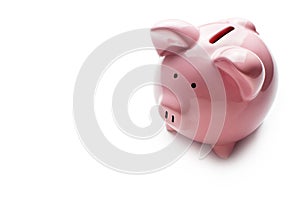 Little pink piggy bank on white