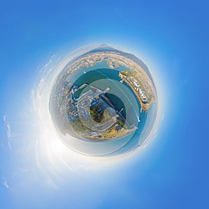 Little planet 360 degree sphere. Panorama of aerial view of Mountain Fuji near industrial area, factory, Japanese port and harbour