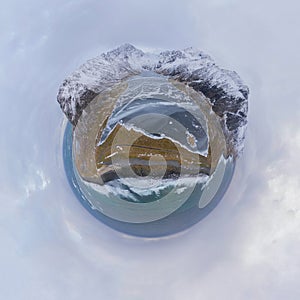 Little planet 360 degree sphere. Panorama of aerial view of white snow mountain in Lofoten islands, Nordland county, Norway,
