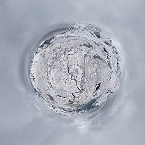 Little planet 360 degree sphere. Panorama of aerial view of white snow mountain in Lofoten islands, Nordland county, Norway,