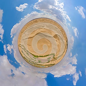 Little planet 360 degree sphere. Panorama of aerial top view of love lake and sand desert, Heart shaped lakes in Al Qudra in Dubai photo