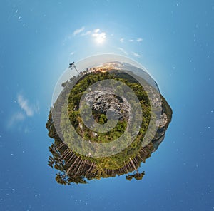 Little planet panorama at night with clouds and