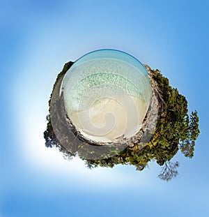 Little planet panorama on white sandy beach