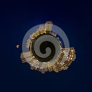 Little planet transformation of spherical panorama 360 degrees. Spherical abstract aerial night view multi-storey buildings.