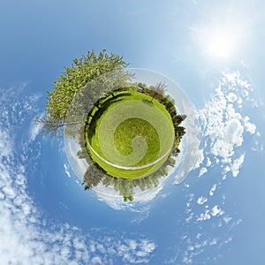 Little planet with trees and green meadow