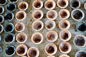 Little Pottery Cup. Orderly, Red brown. On the wood table.