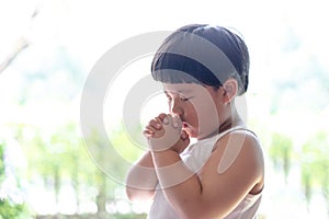 A little prayer, A boy is praying seriously and hopefully to Jesus